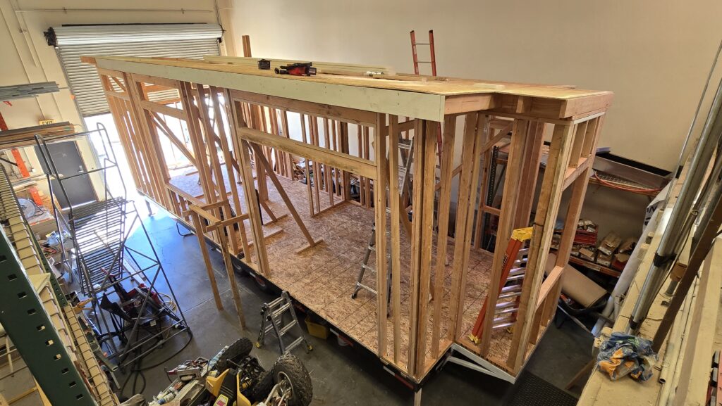 a tiny house under construction in a workshop